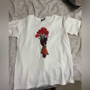 white tshirt with fliers and saying